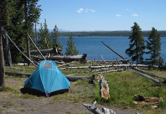 tent camping lake trees