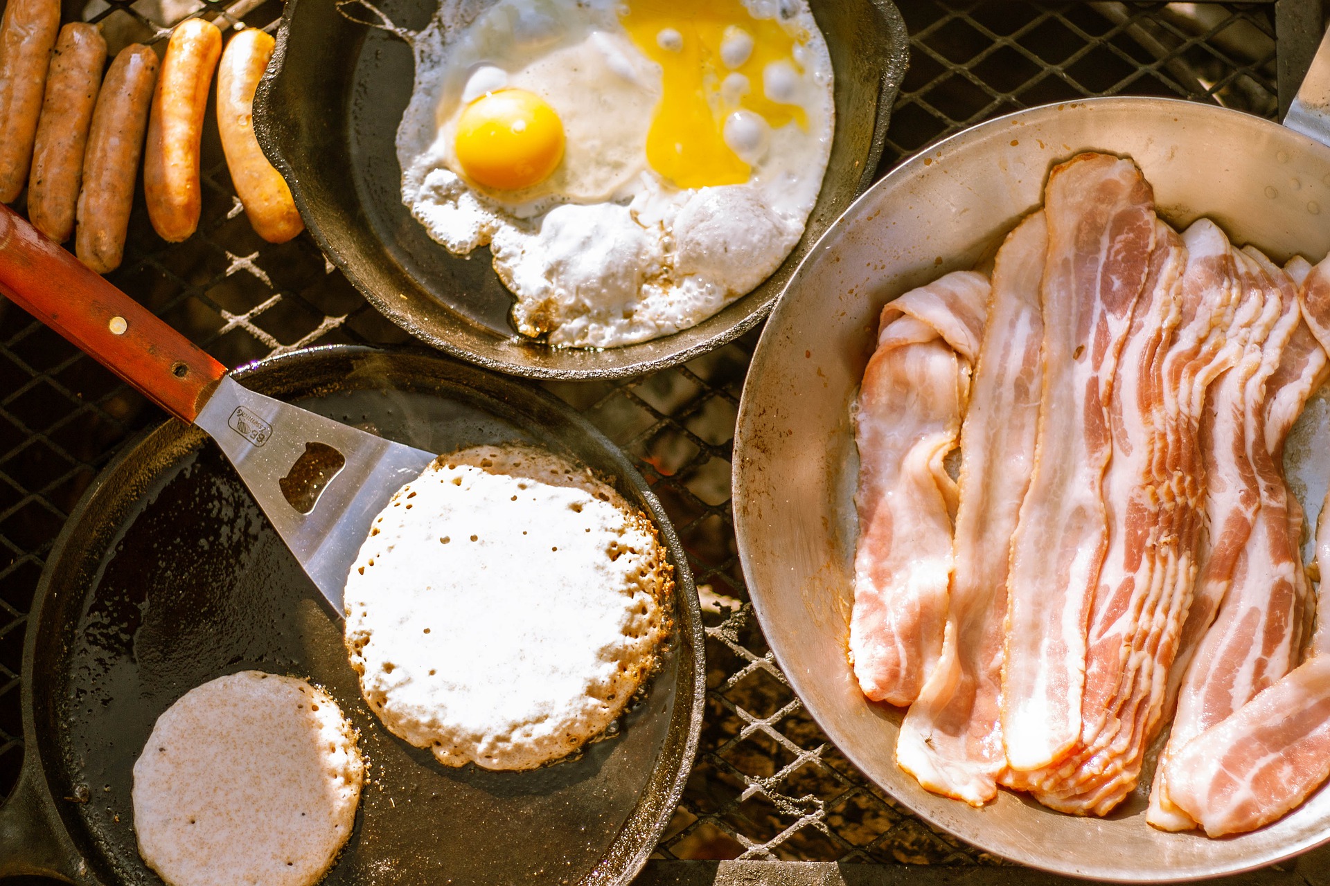 camping breakfast fire pancakes eggs bacon sausage 